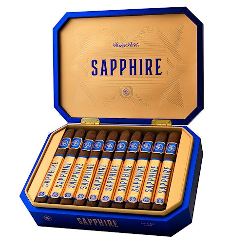 An open blue and gold cigar box containing ten cigars, shown on a plain white background. The box lid is open, displaying the brand name 'SAPPHIRE' in blue text on a gold interior, and the cigars are neatly arranged inside.
