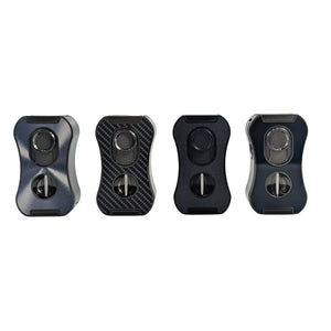 Four black fidget spinners with different textures on a white background