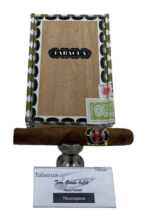 Cigar and packaging with 'Tabacua' branding on a white background